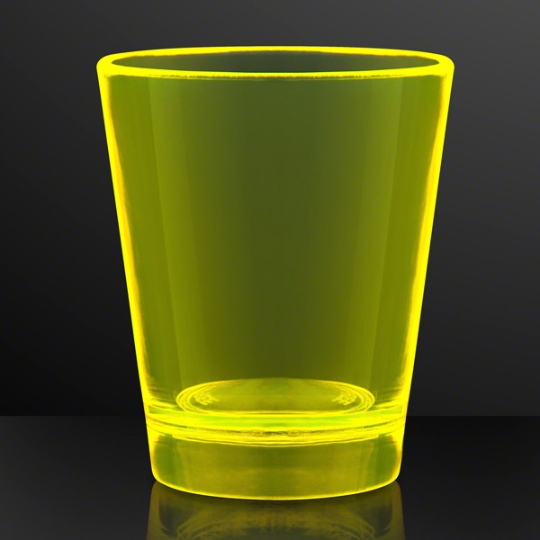 shot glass in yellow that glows under a black light